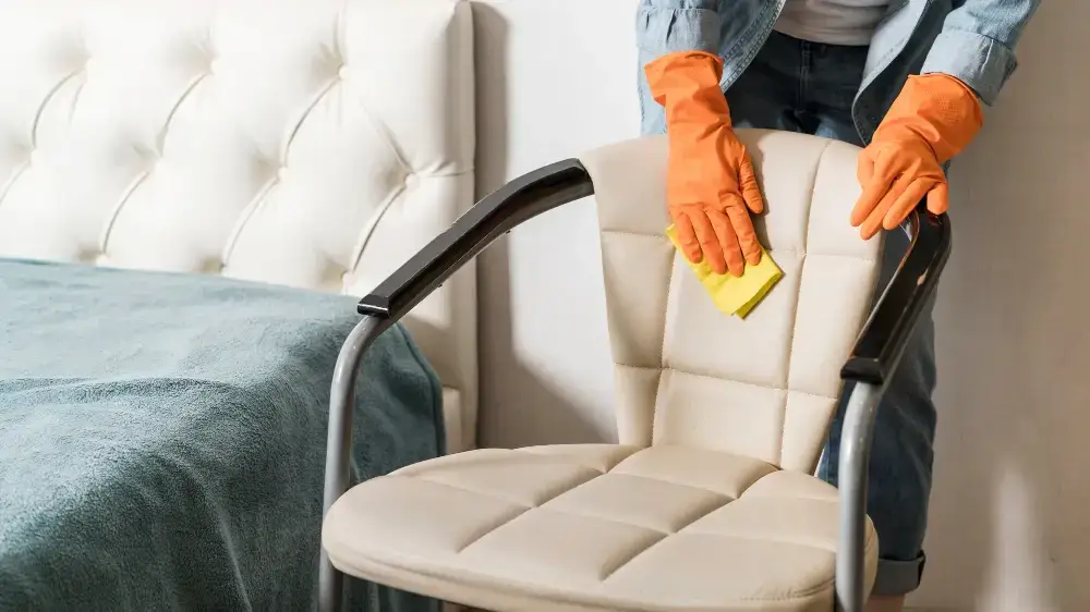 person cleaning office chair bedroom