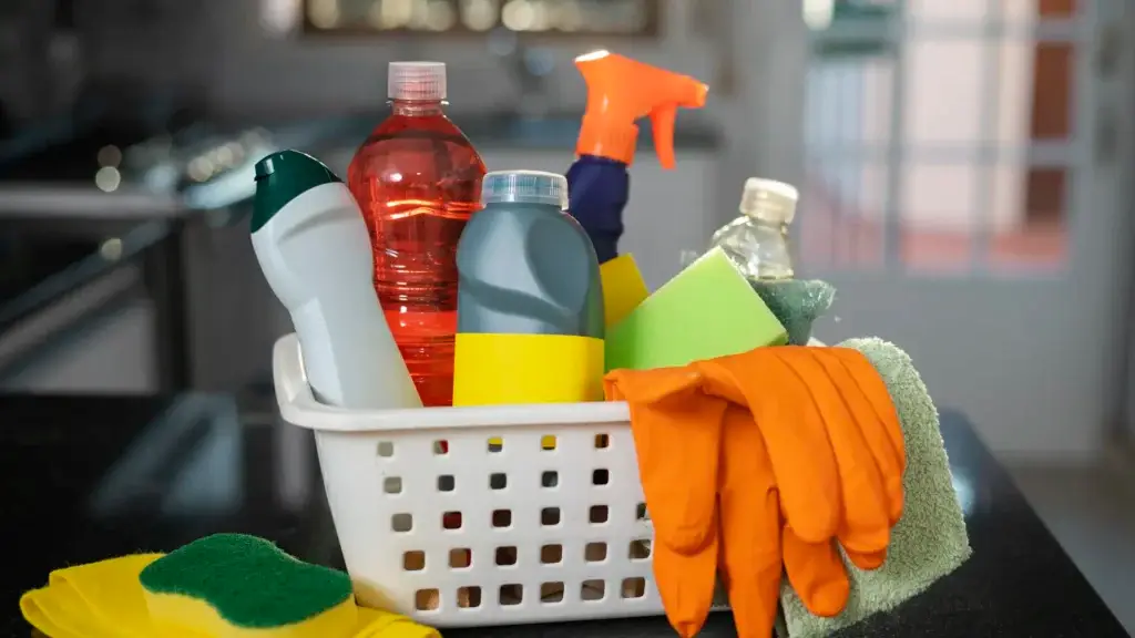 Basket of cleaning supplies, gloves and sponges